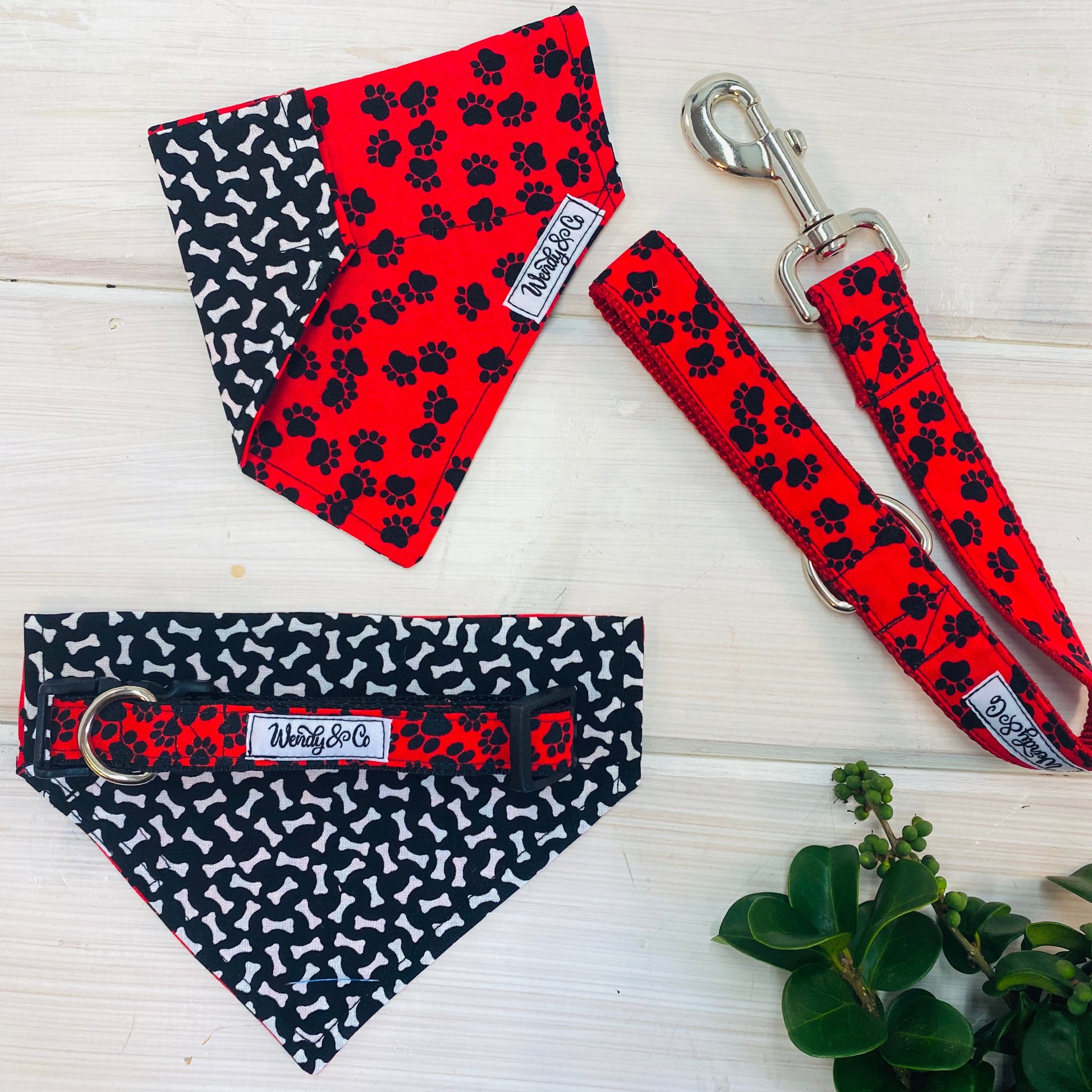 Red with black paws dog bandana, leash and collar.