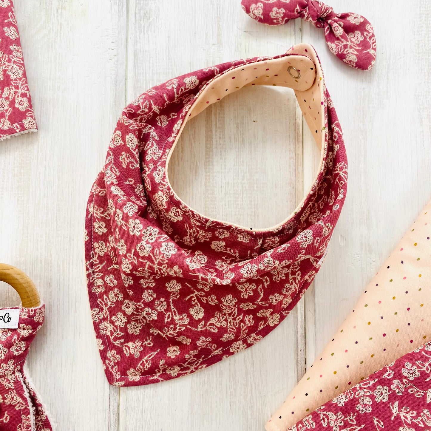 Primrose pink baby bib in a vintage bandana style.