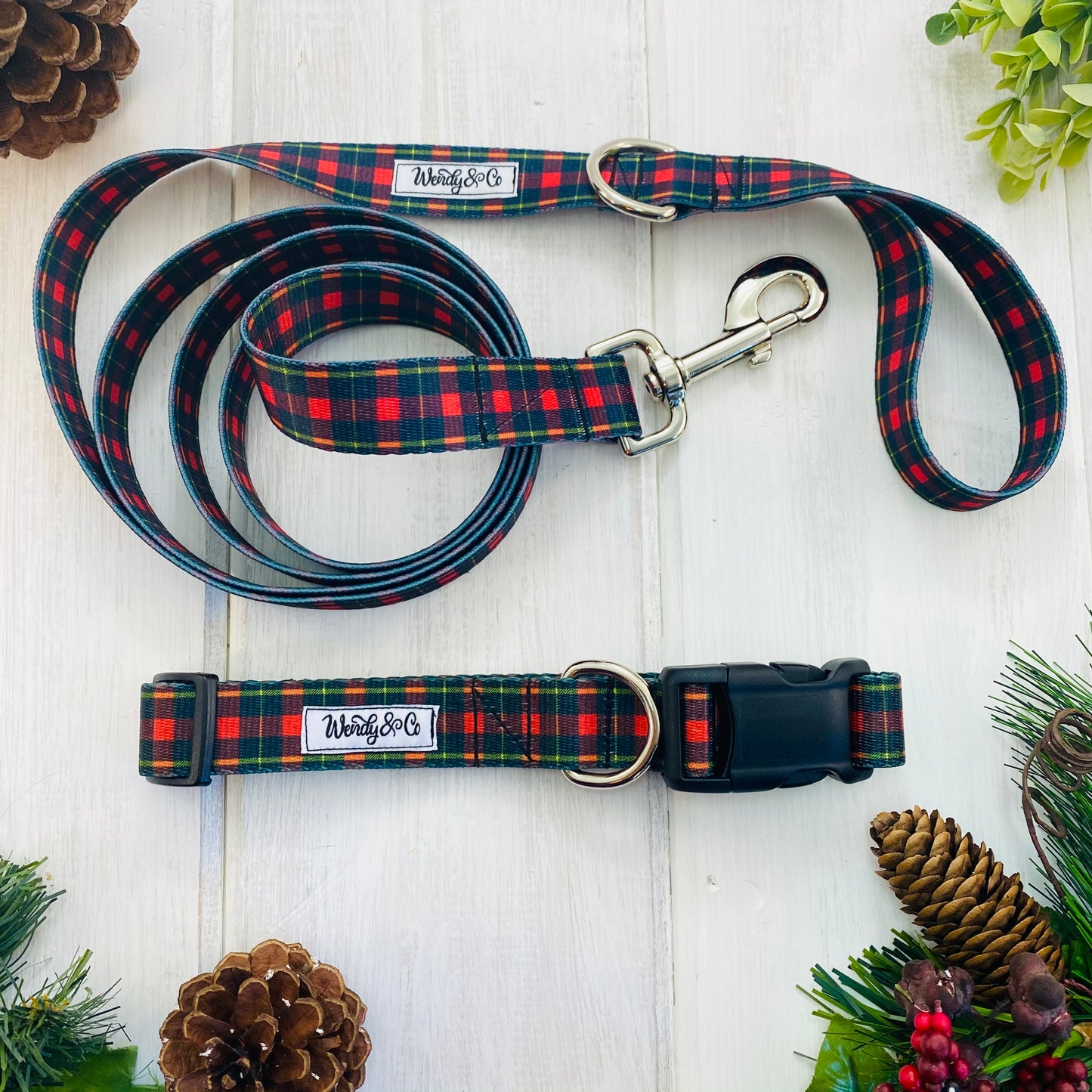 Red and black plaid print dog collar and leash.