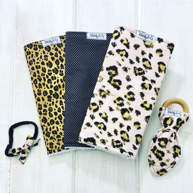 Cheetah animal print collection of burp cloths, teether and headband.