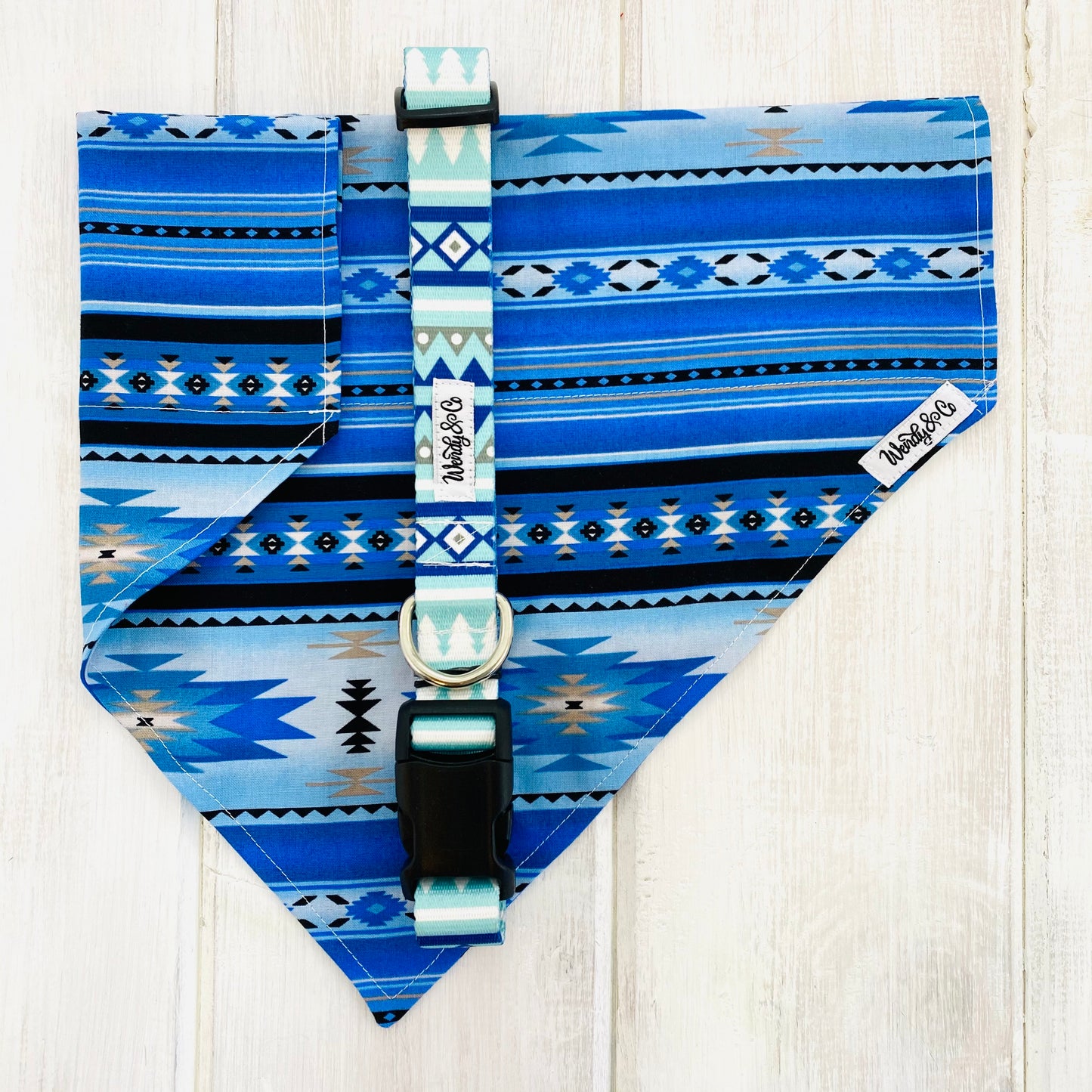 Dog bandana in blues and black with a native design.