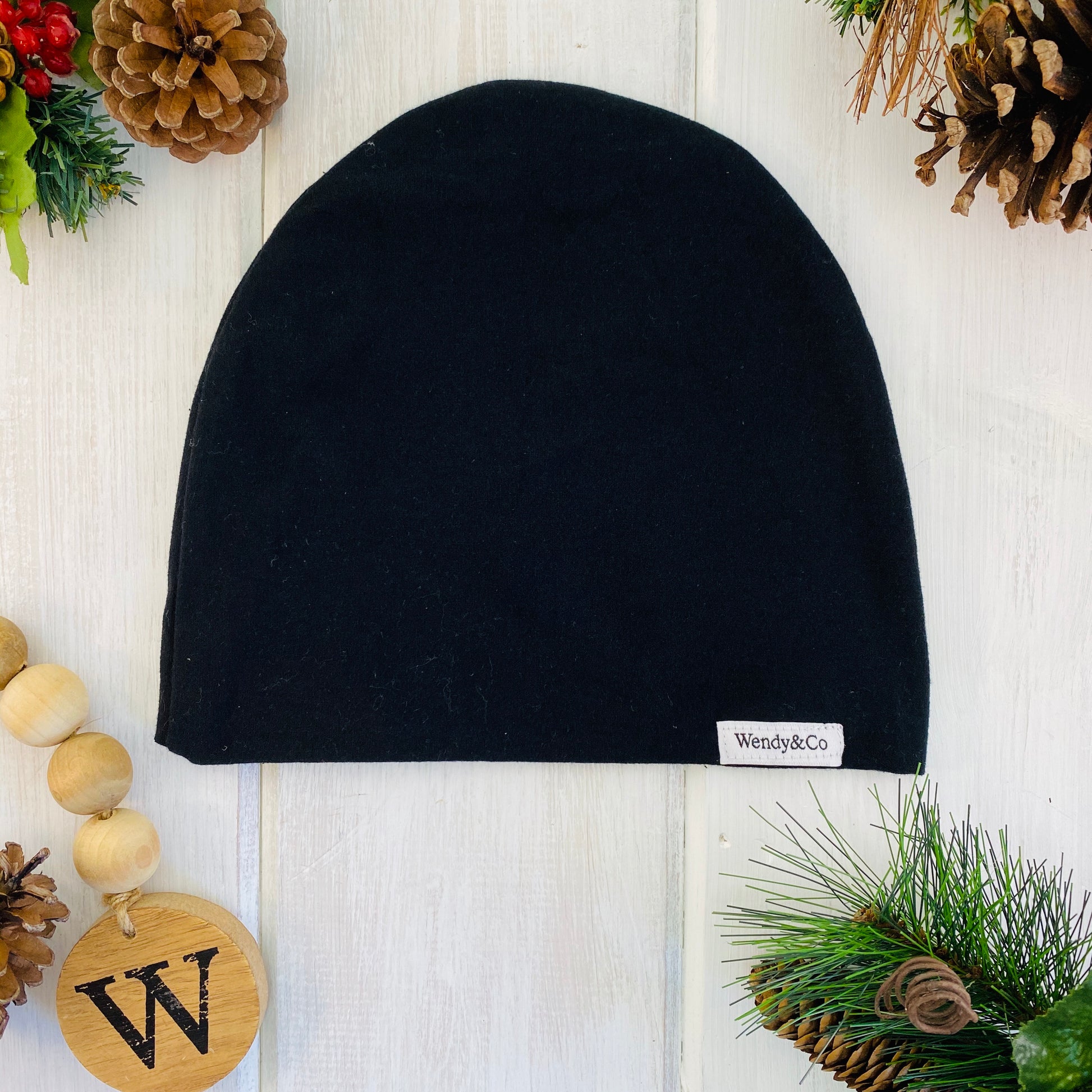 Solid black slouchy modern fit beanie.