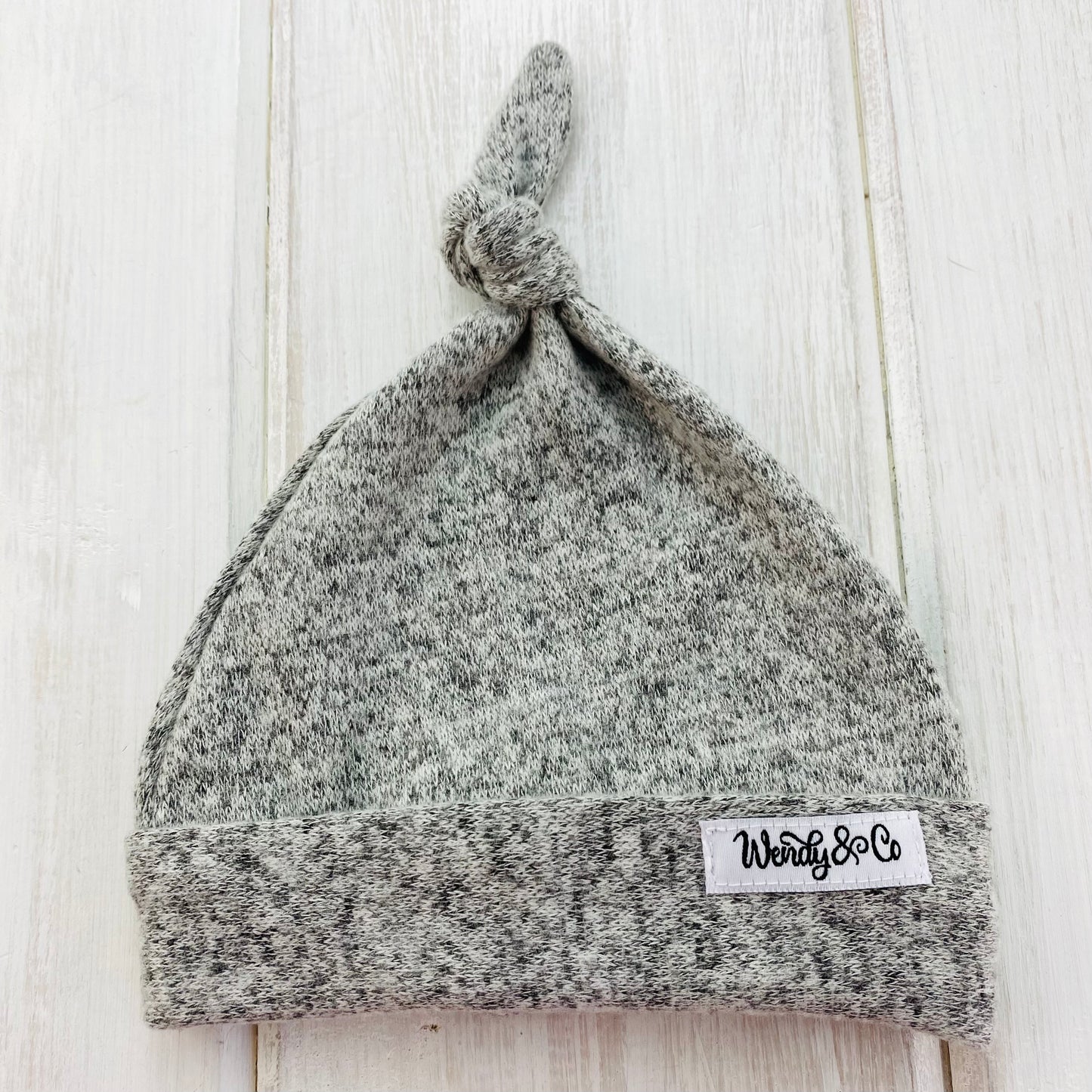 Super soft gray newborn hat with top knot.