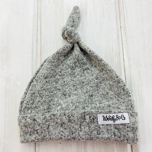 Super soft gray newborn hat with top knot.