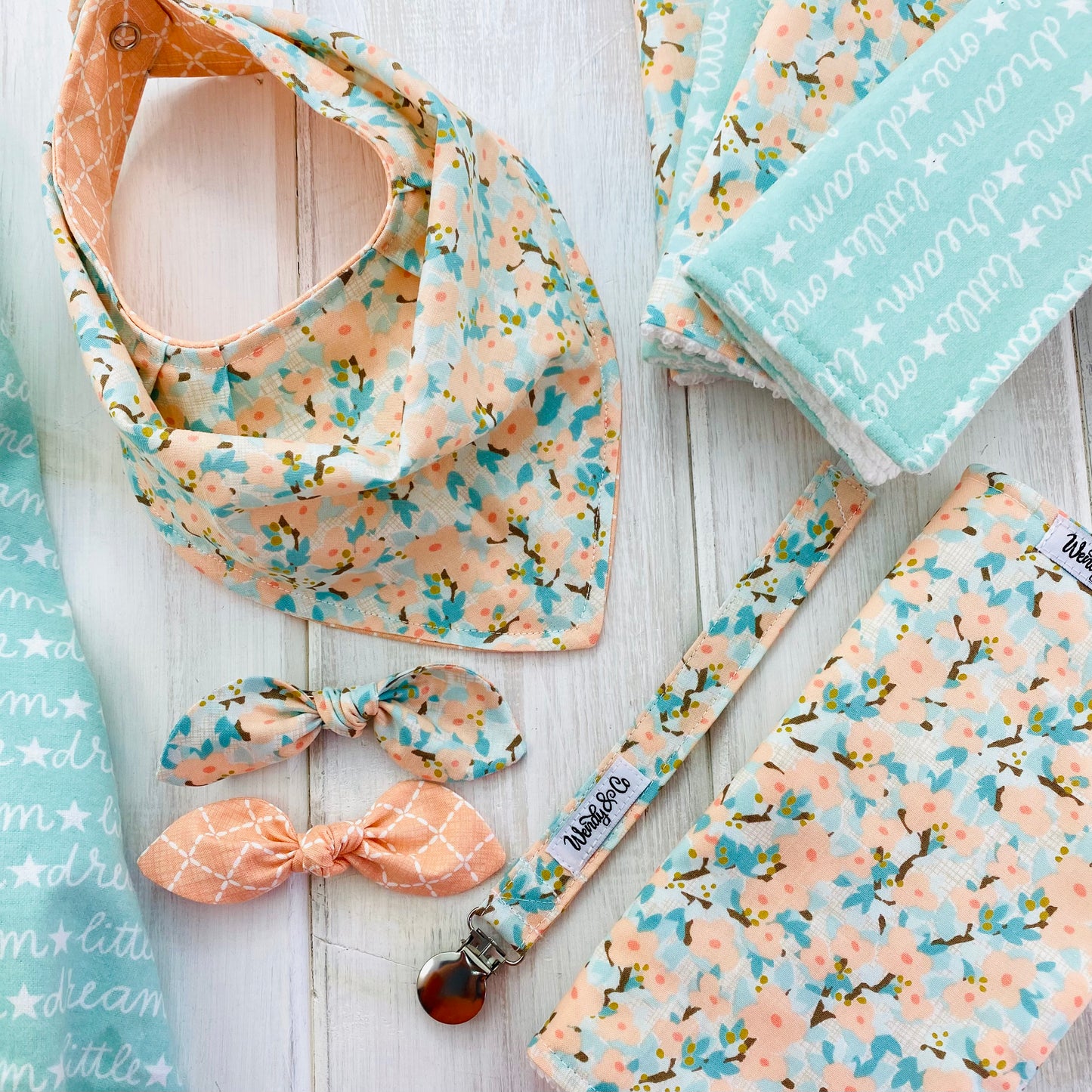 Beautiful floral dogwood baby gift set in peach, mint and aqua.
