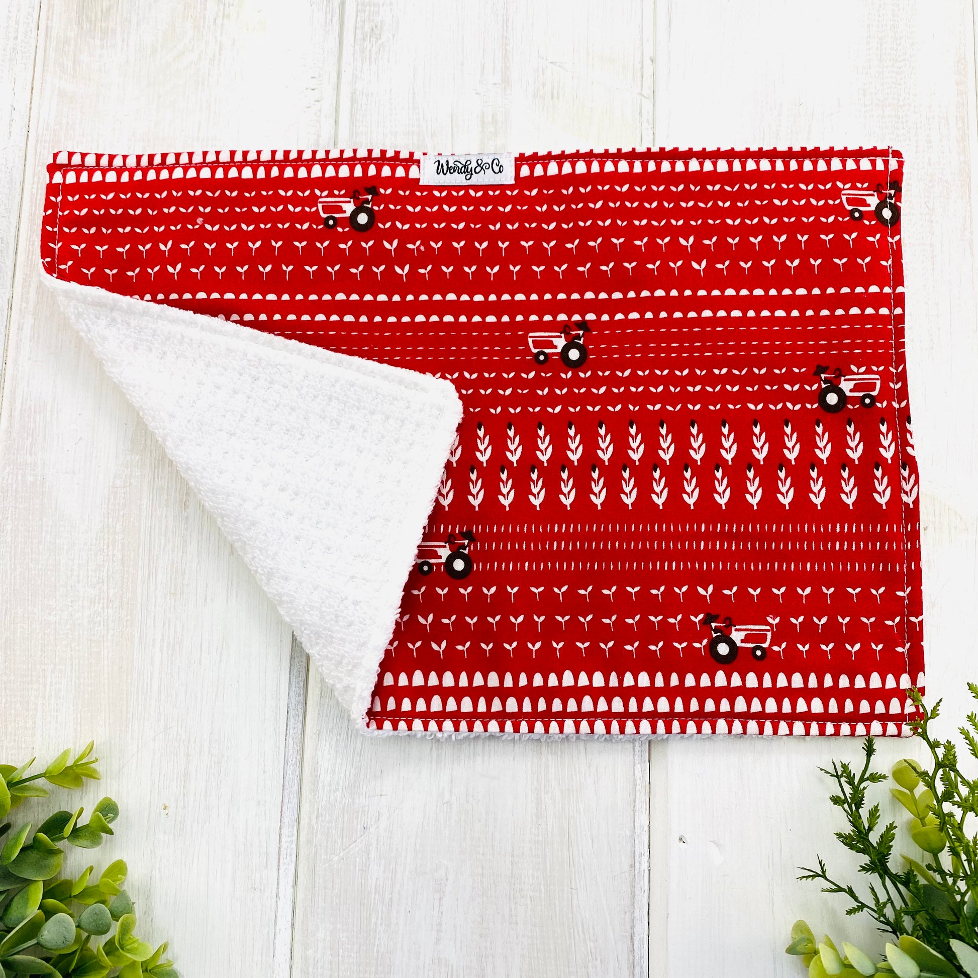 Very absorbent burp cloth drool rag for baby in red tractor print.