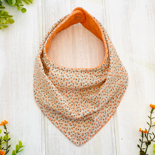Boho style Coral Ditsy bib- a beautiful feminine print with soft coral flannel on the reverse side