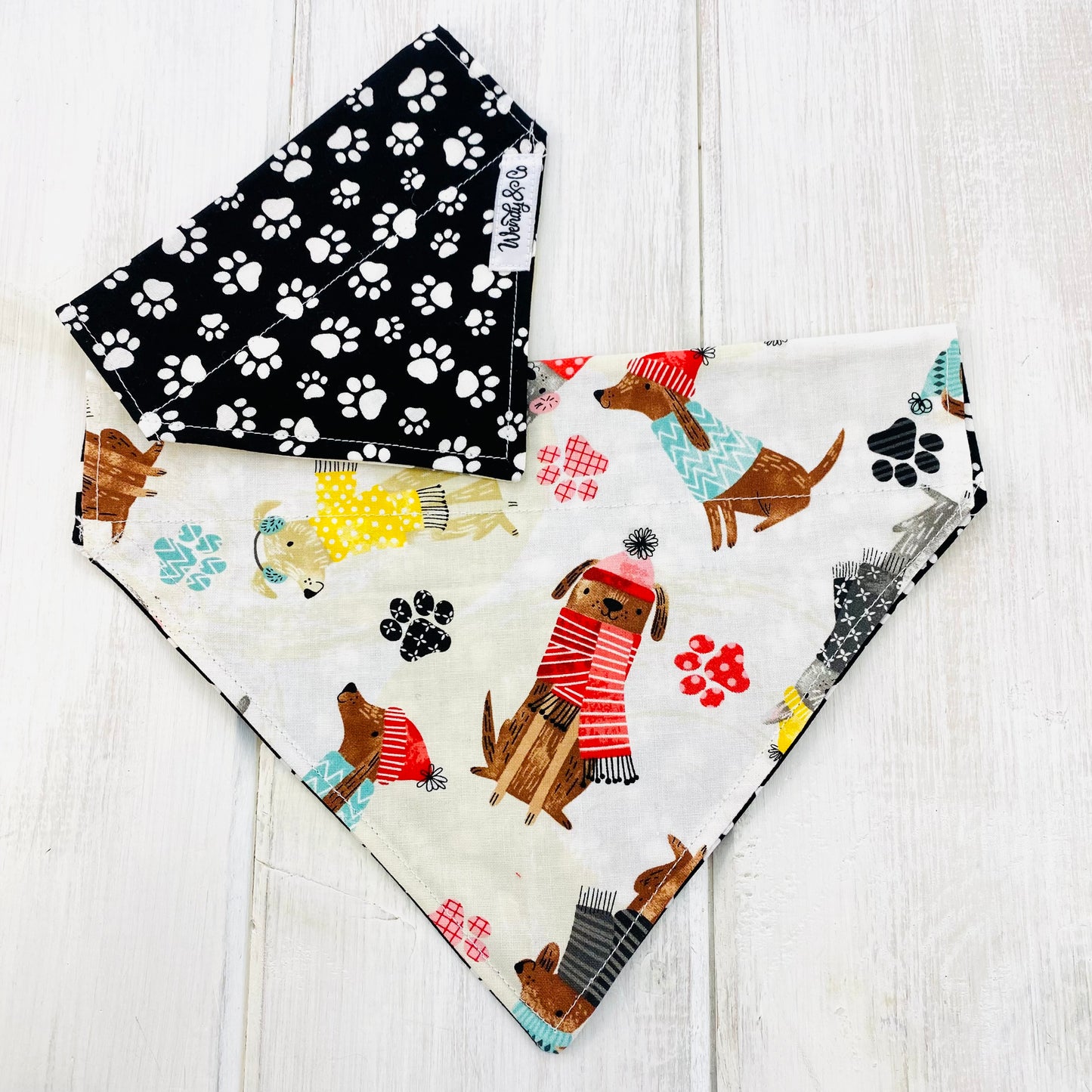 Cute winter print dog bandana with dogs in sweaters.