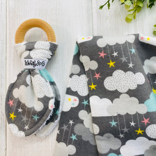 Organic teether and large blanket in soft flannel fabric in clouds and stars.