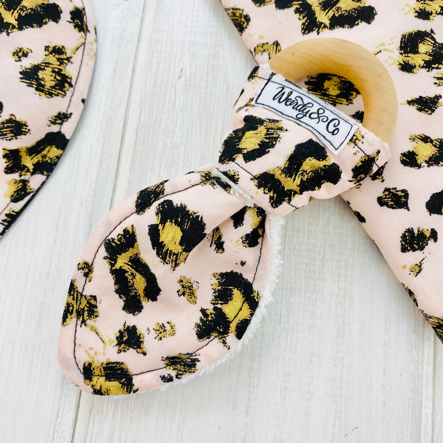 Blush pink cheetah animal print fabric with black and gold accents baby teether, handmade, maple wood.